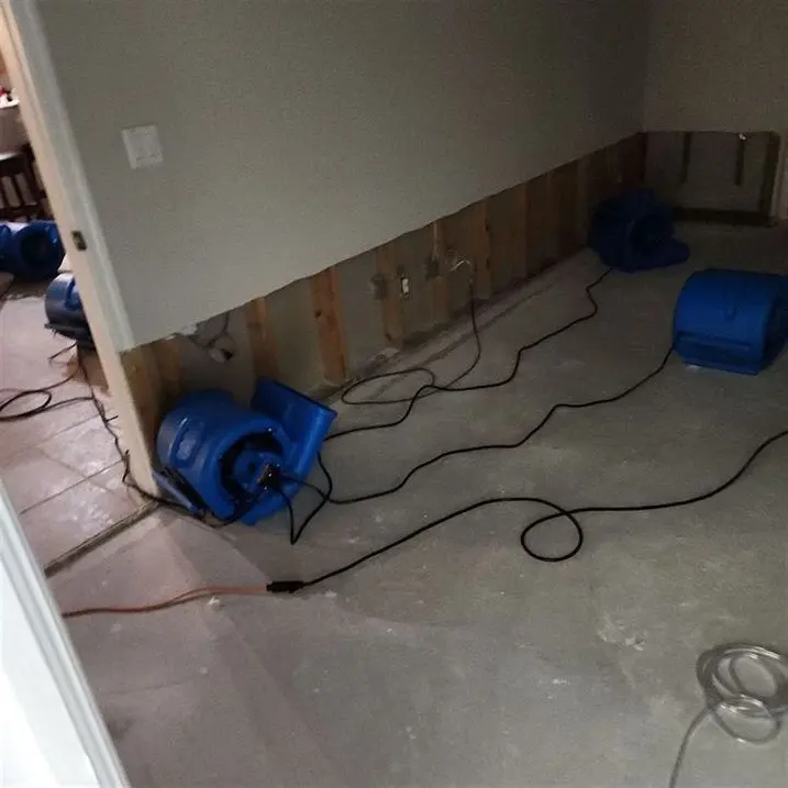 Air movers drying a great room after a Fort Worth water loss